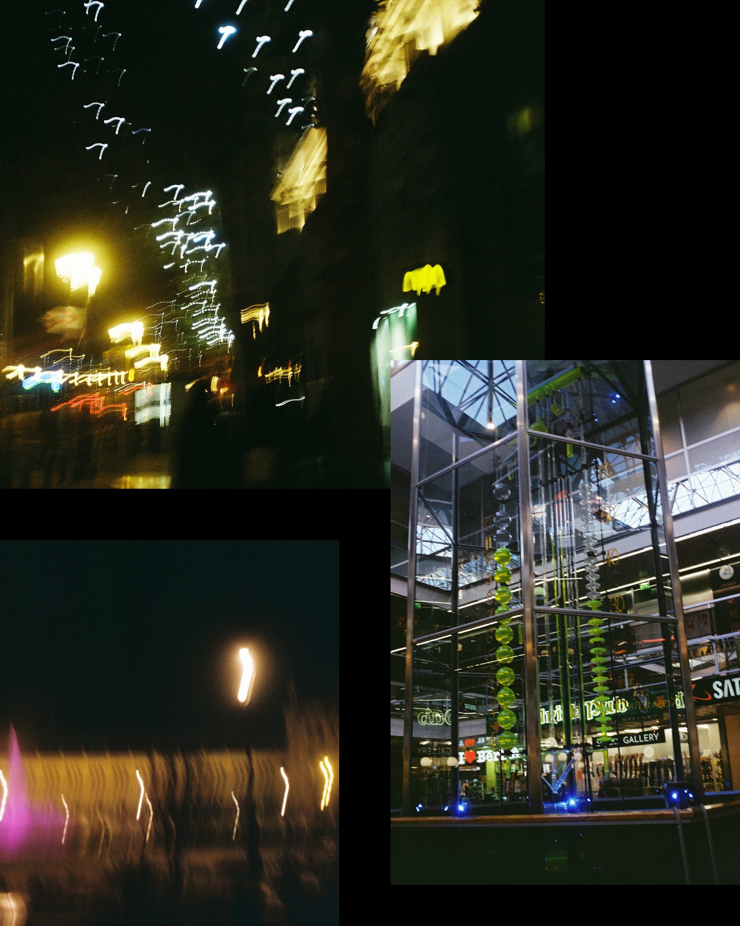 Slide 2 of 2: more light streaks, and a glass tower with green sculptures inside a mall at night